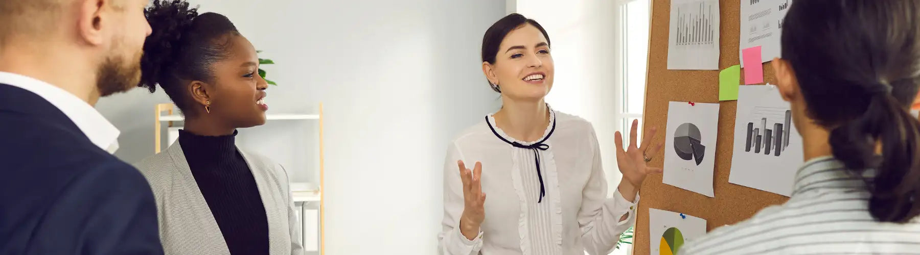 White blouse with black ribbon tie at the neckline